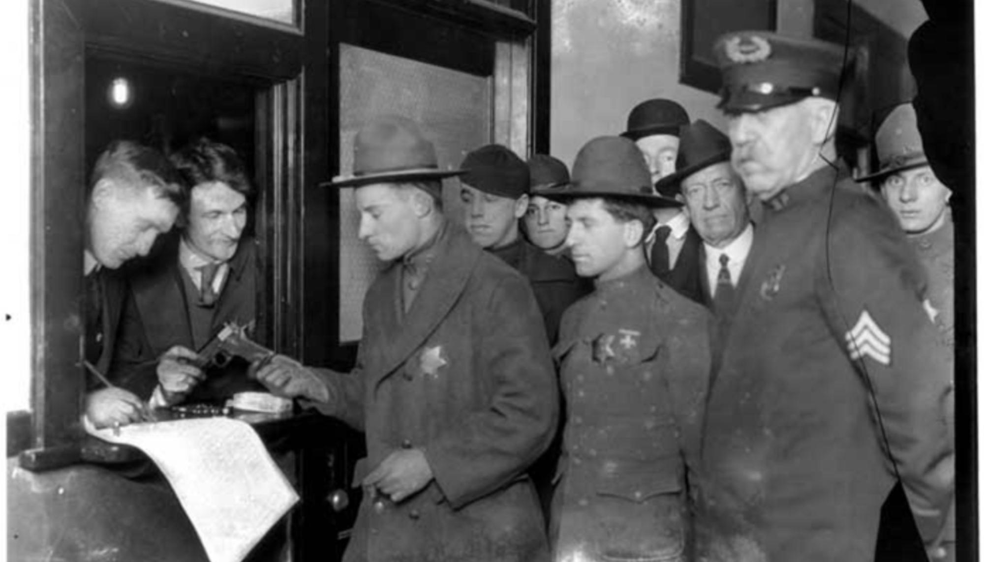 Seattle General Strike deputies receiving weapons, February 6, 1919. Webster & Stevens